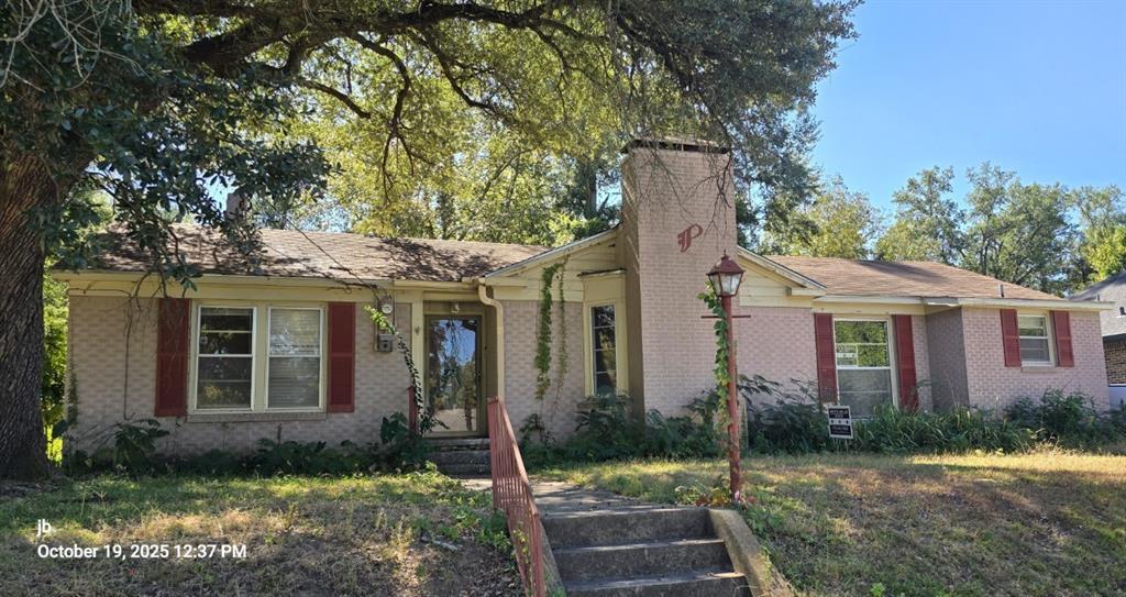 1314 South Azalea Drive Tyler, TX 75701 - Photo 3 of 27 a front view of a house with garden