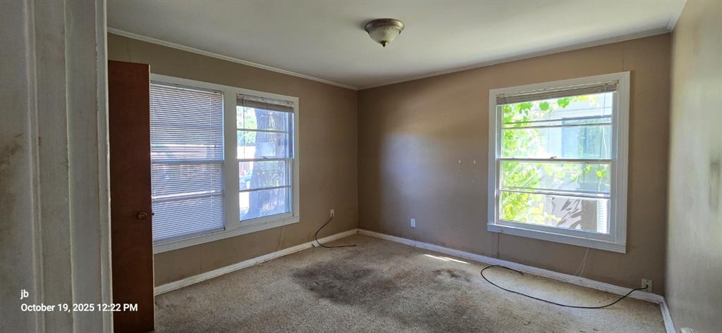 1314 South Azalea Drive Tyler, TX 75701 - Photo 7 of 27 an empty room with a window
