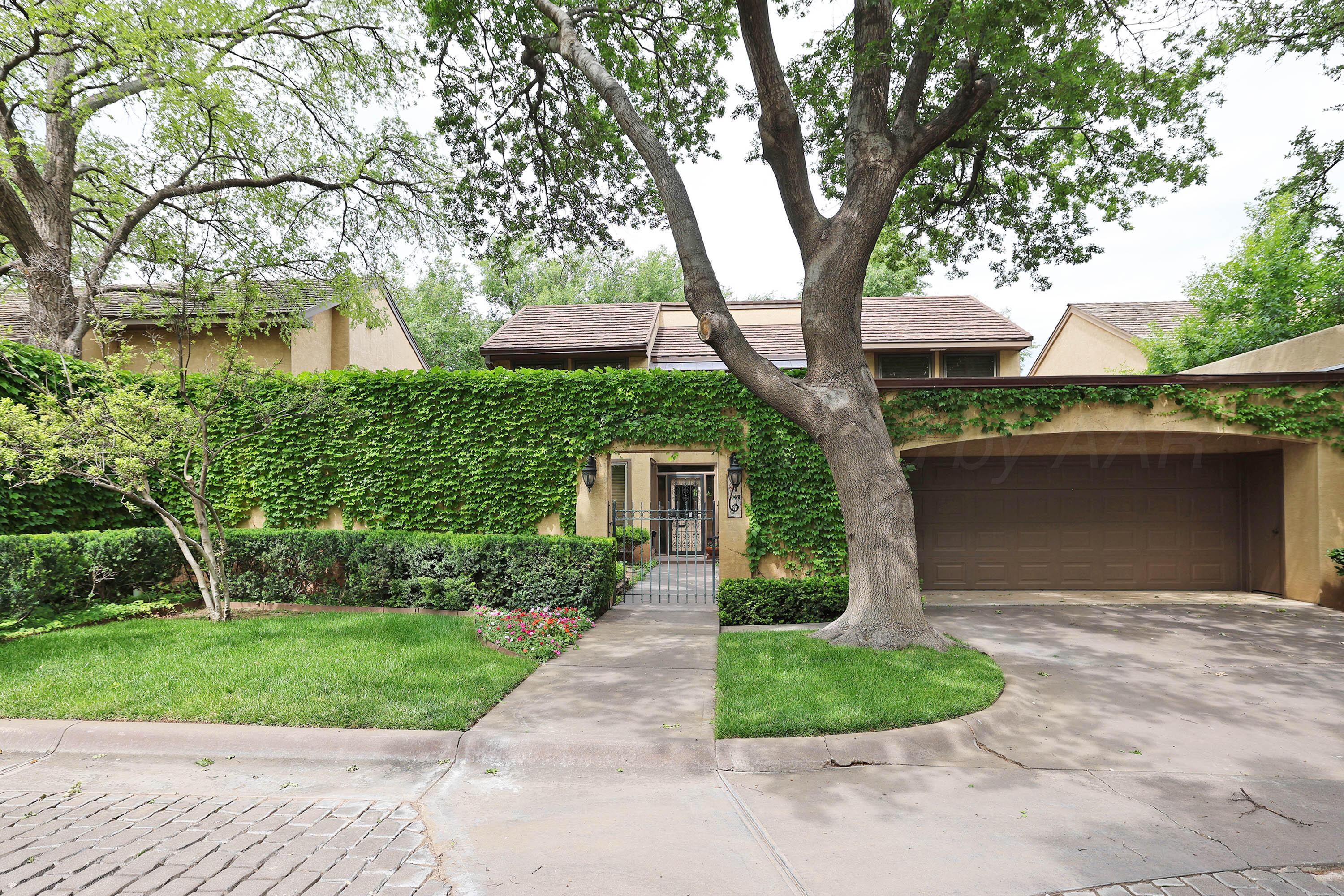 6 Woodstone Street Amarillo, TX 79106 - Photo 1 of 35 front view of a house with a yard