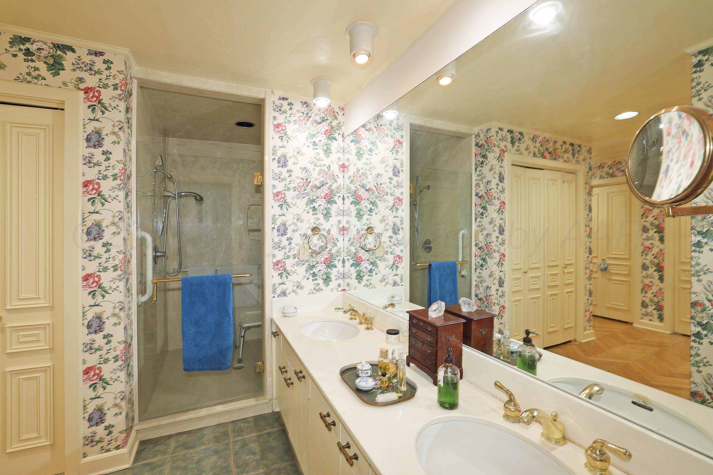 6 Woodstone Street Amarillo, TX 79106 - Photo 22 of 35 a bathroom with a double vanity sink mirror and shower