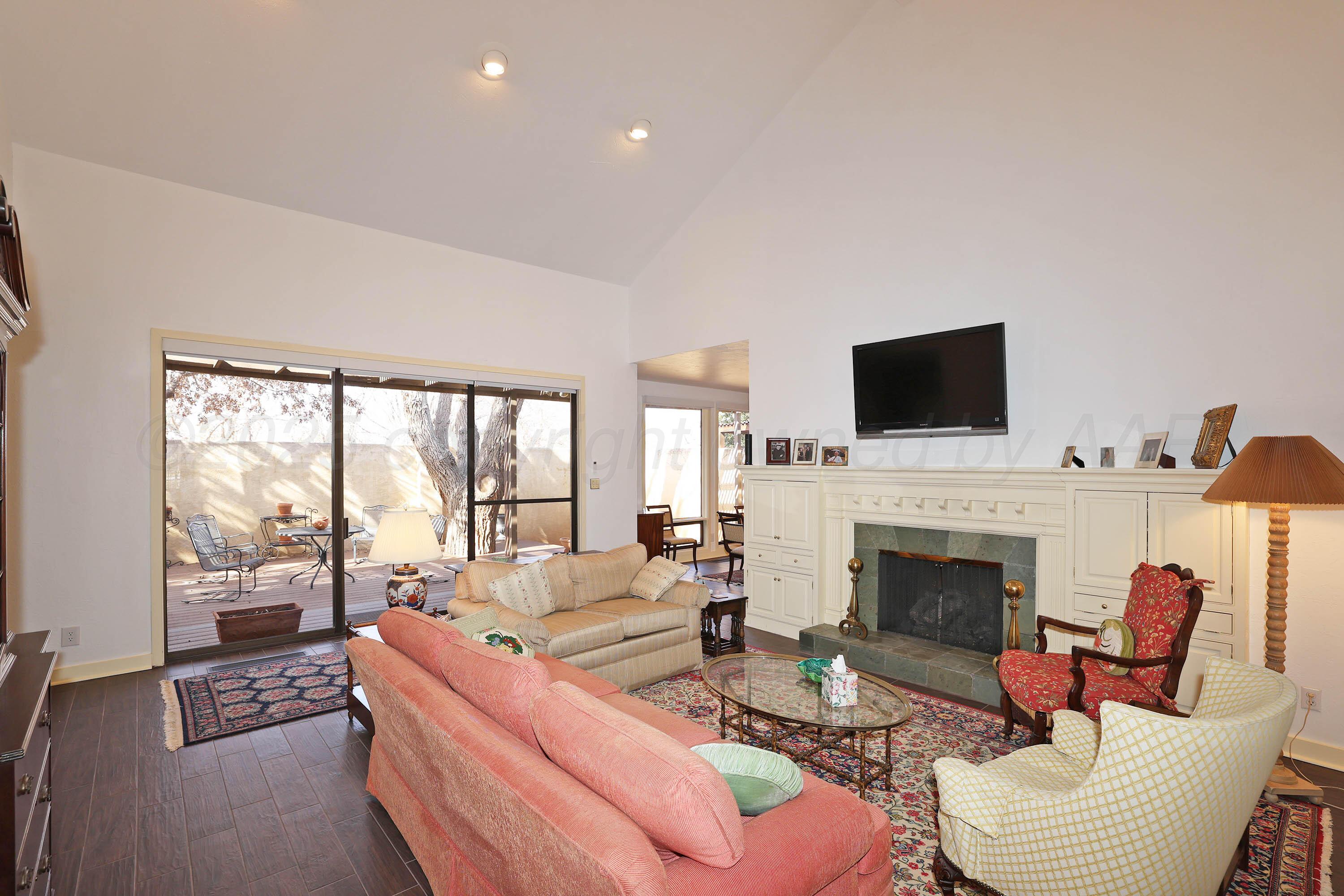 6 Woodstone Street Amarillo, TX 79106 - Photo 9 of 35 a living room with furniture fireplace and flat screen tv