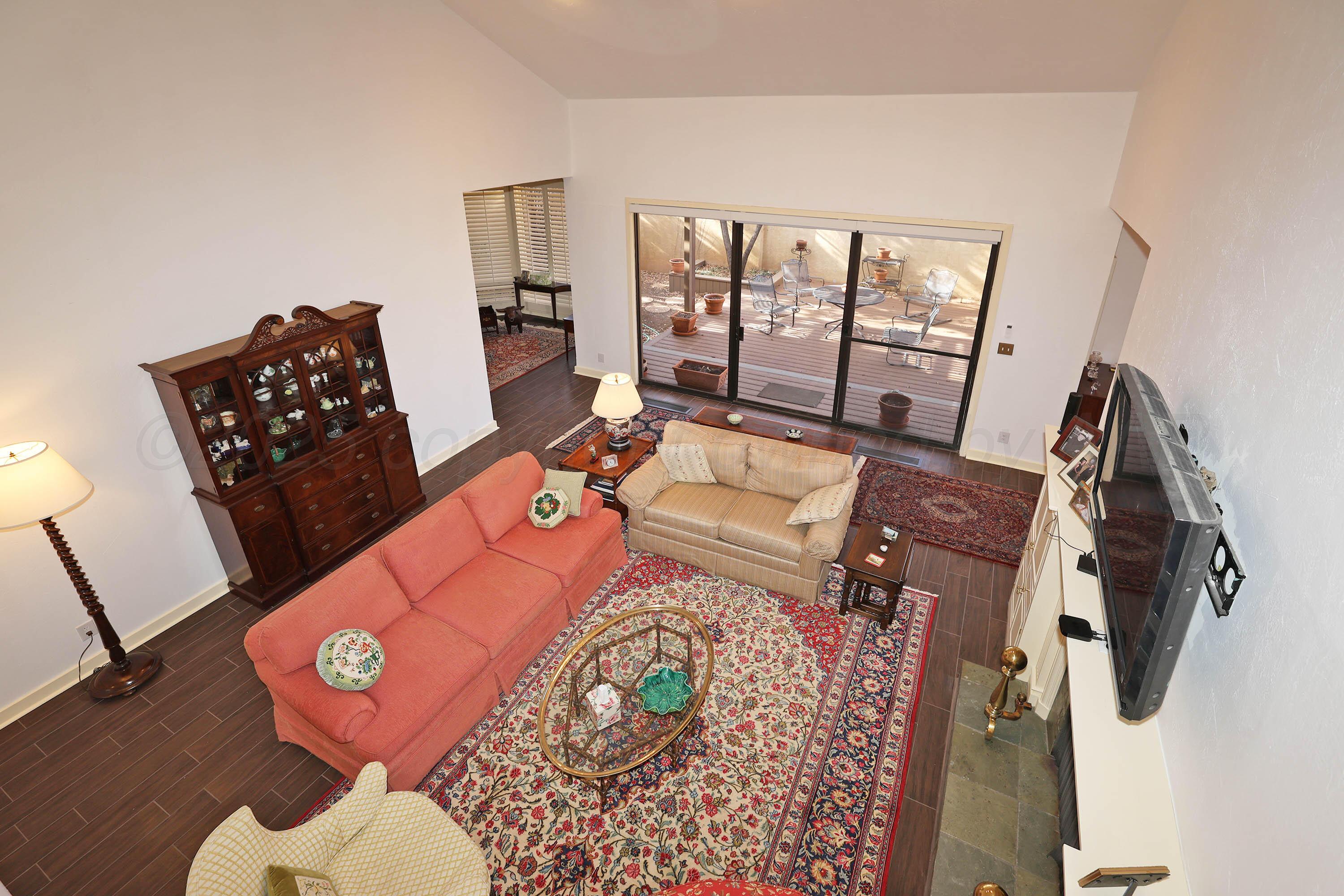 6 Woodstone Street Amarillo, TX 79106 - Photo 10 of 35 a living room with furniture and a floor to ceiling window