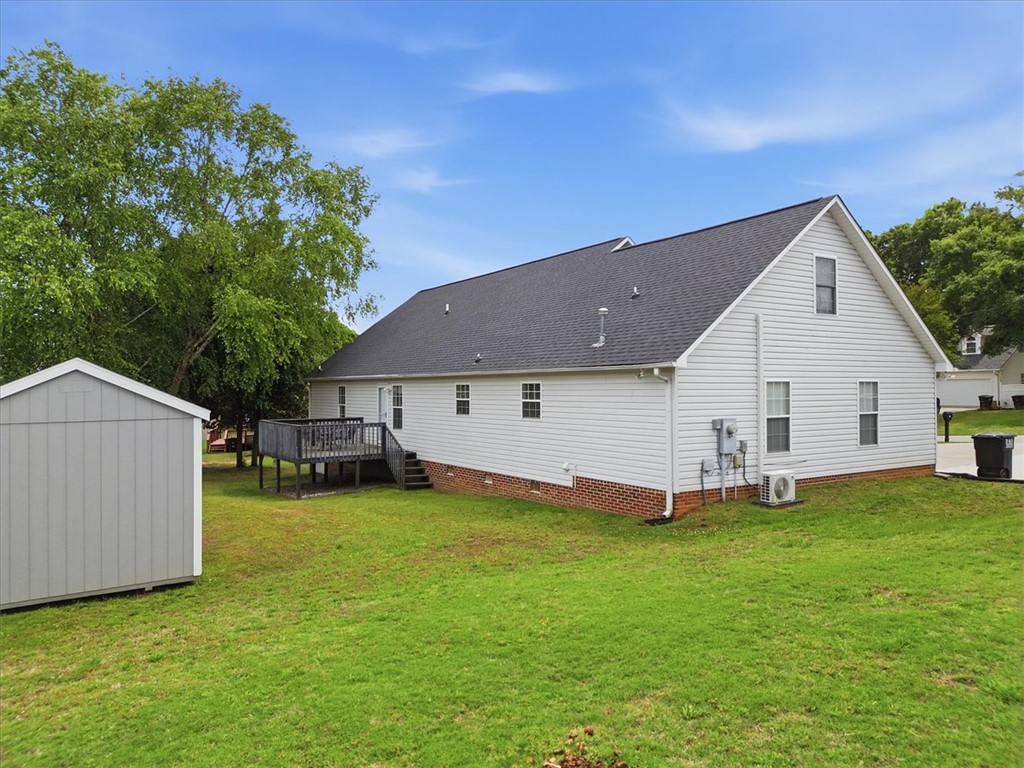 166 Amberwood Drive Anderson, SC 29621 - Photo 28 of 38 This spacious backyard features a versatile shed and a charming deck.