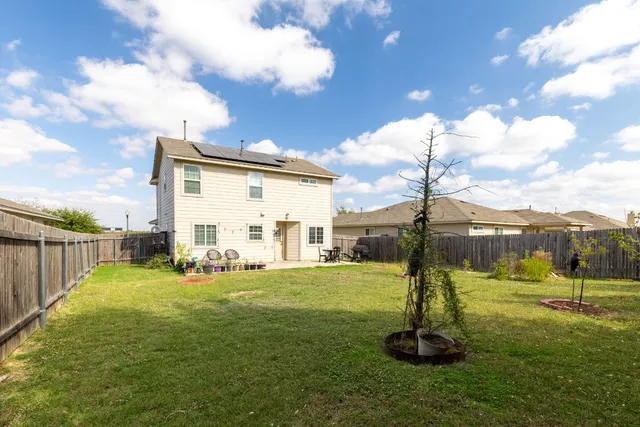a view of a entertaining space in front of a house
