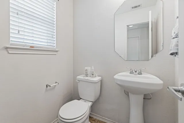a bathroom with a sink toilet