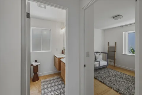 a bedroom with a bed and a potted plant