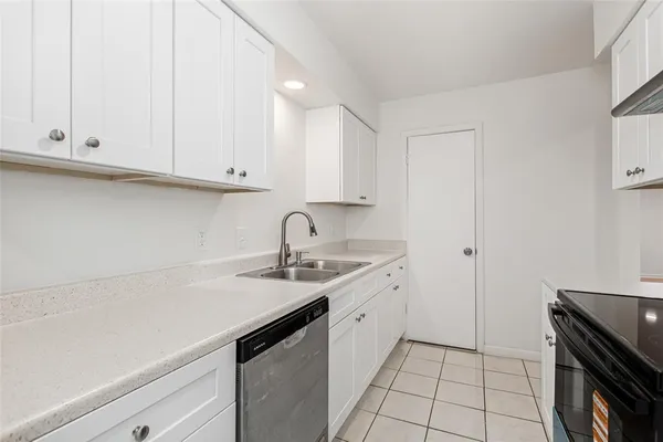 a kitchen with a sink and cabinets