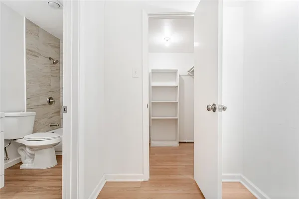 a view of a bathroom with a toilet and a shower