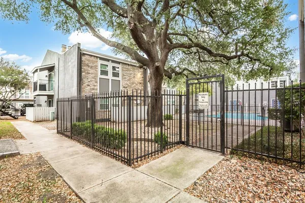 a view of a wrought iron fences in front of house