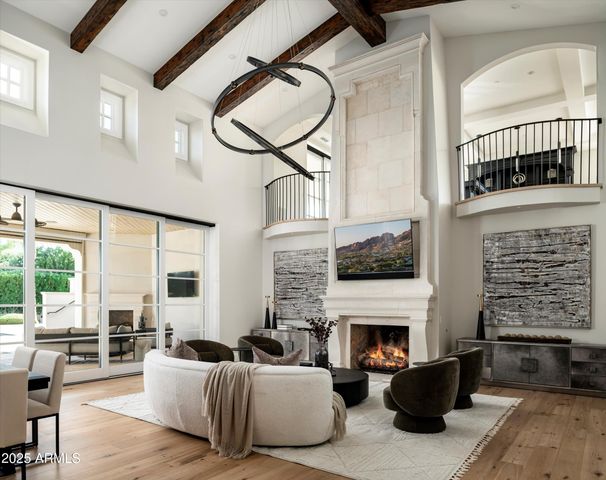 a view of a street with a large barn