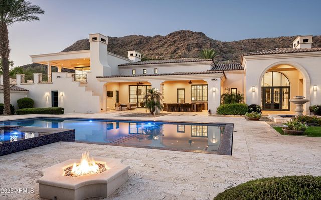 a bathroom with a sink and a large mirror