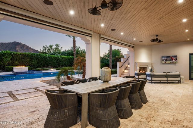 a view of a house with a yard porch and sitting area