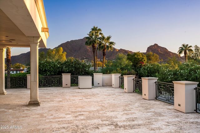 a view of a house with a yard and a garage