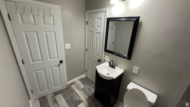 3547 East Golden Eagle Road Eagle Mountain, UT 84005 - Photo 31 of 47 Half bath featuring vanity and dark wood finished floors