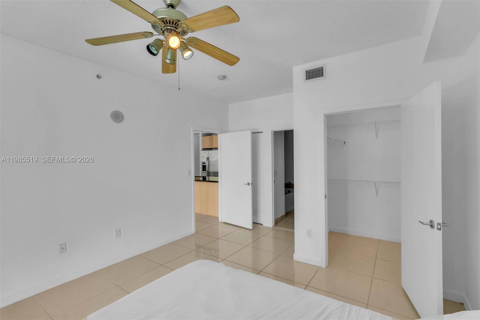 79 Southwest 12th Street, Unit 1210 Miami, FL 33130 - Photo 12 of 37 a view of empty room with ceiling fan