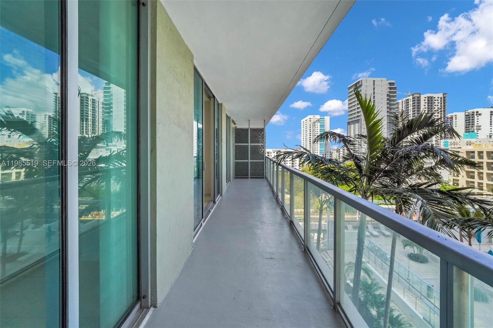 79 Southwest 12th Street, Unit 1210 Miami, FL 33130 - Photo 22 of 37 a view of balcony with wooden floor