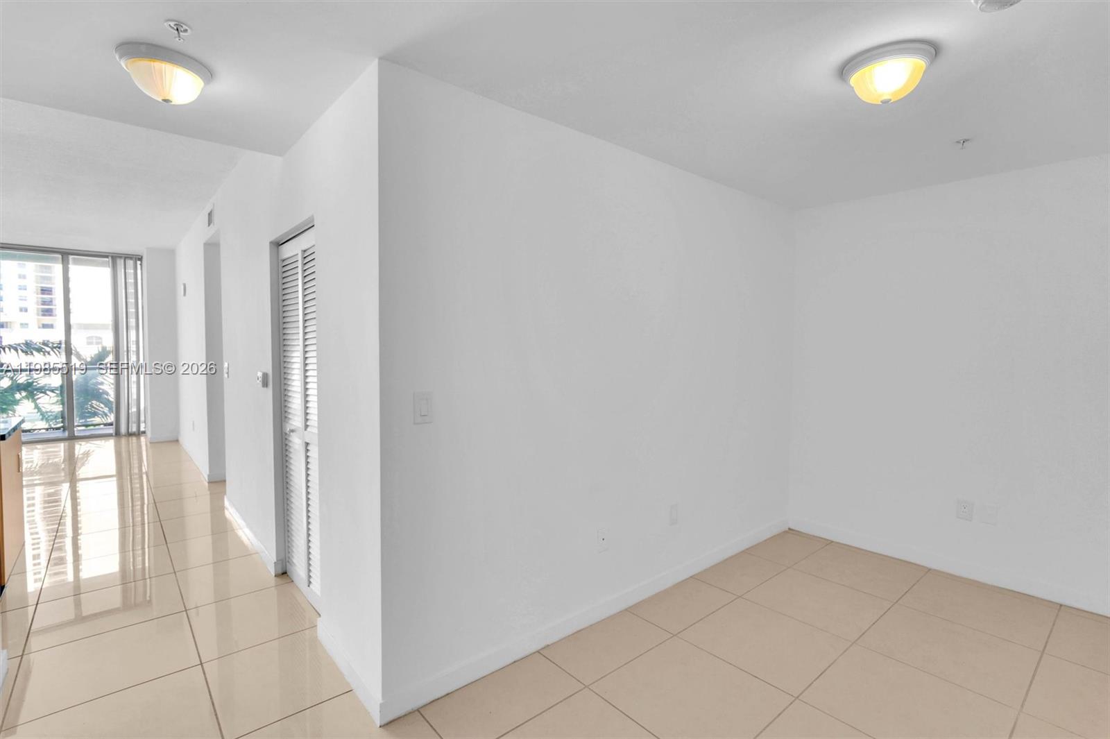 79 Southwest 12th Street, Unit 1210 Miami, FL 33130 - Photo 8 of 37 a view of an empty room and window