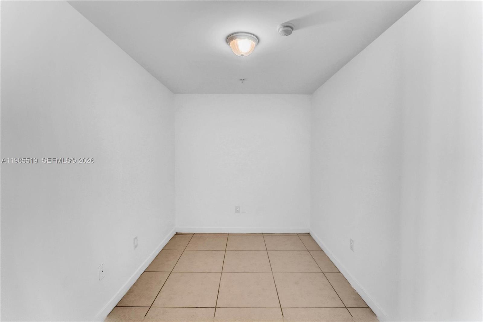 79 Southwest 12th Street, Unit 1210 Miami, FL 33130 - Photo 9 of 37 a view of a room with a white wall and a window