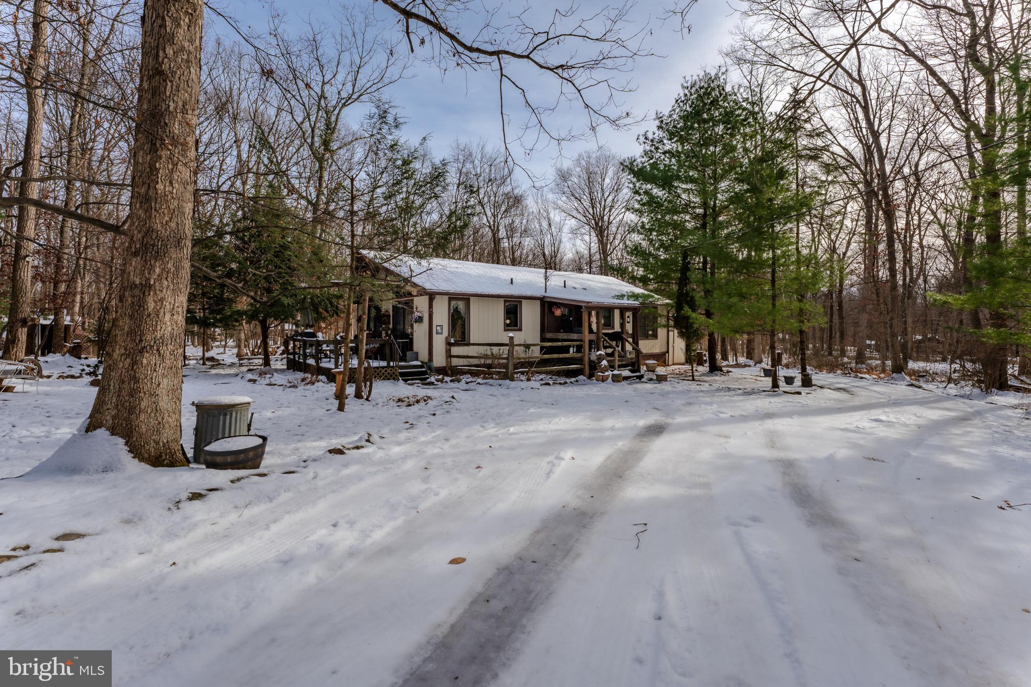 a view of outdoor space with seating area and trees
