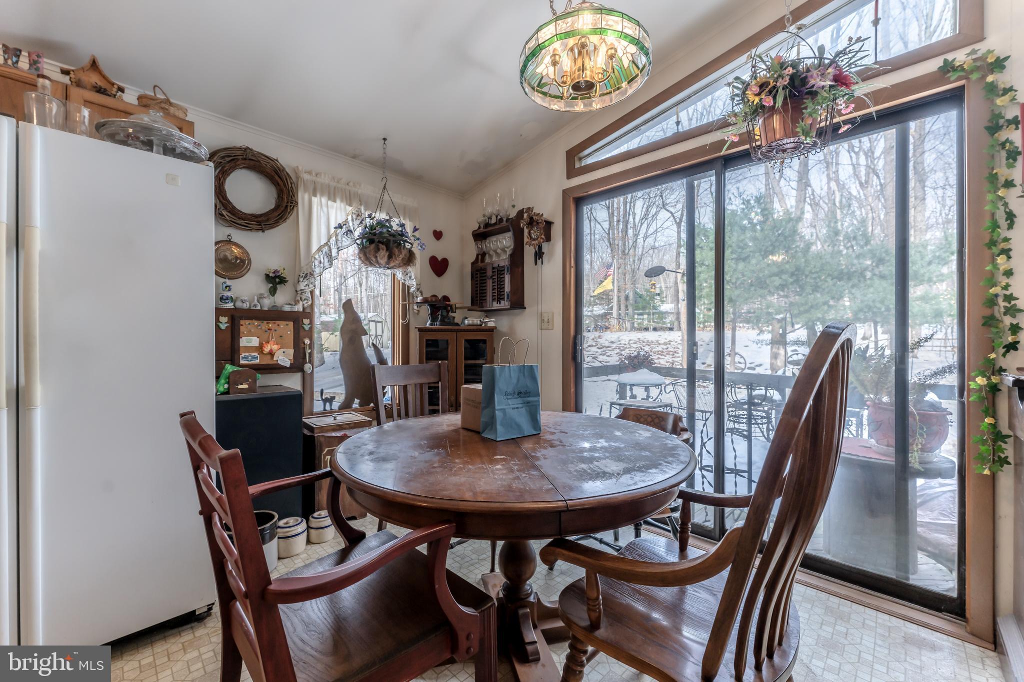 415 White Oak Road Lehighton, PA 18235 - Photo 11 of 45 a view of a dining room with furniture large window and chandelier