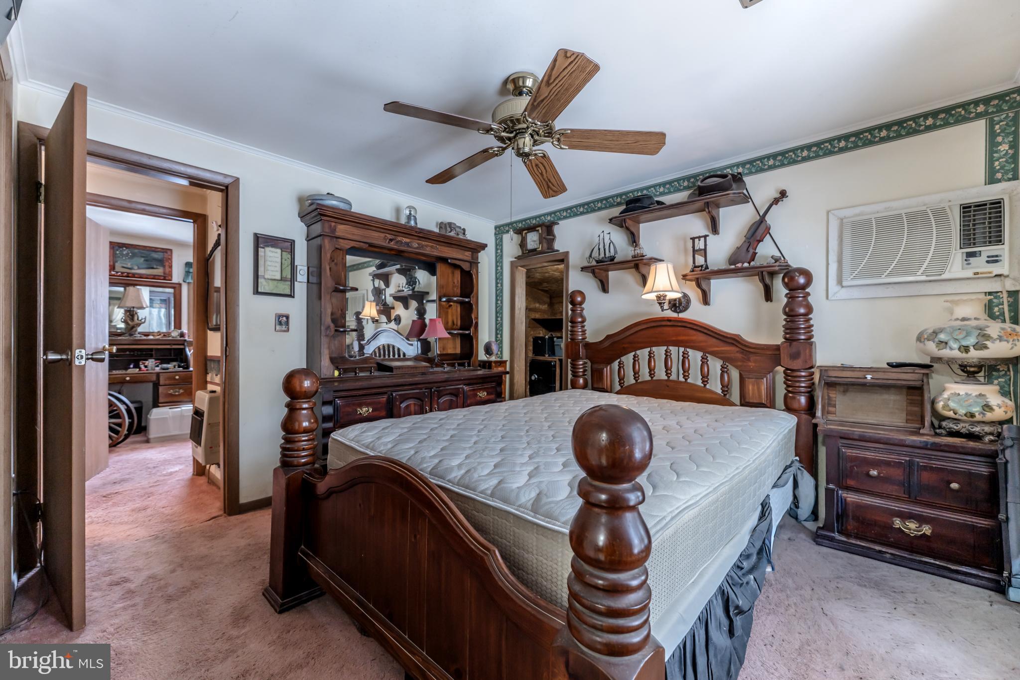 415 White Oak Road Lehighton, PA 18235 - Photo 20 of 45 a bedroom with a bed and a chandelier