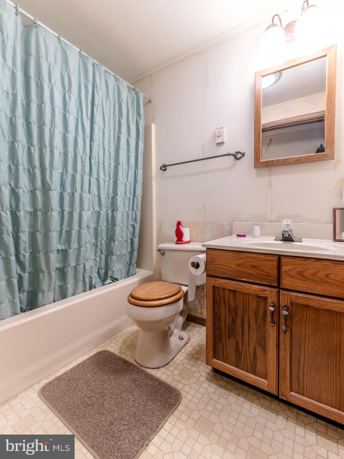415 White Oak Road Lehighton, PA 18235 - Photo 22 of 45 a bathroom with a toilet a sink and a mirror