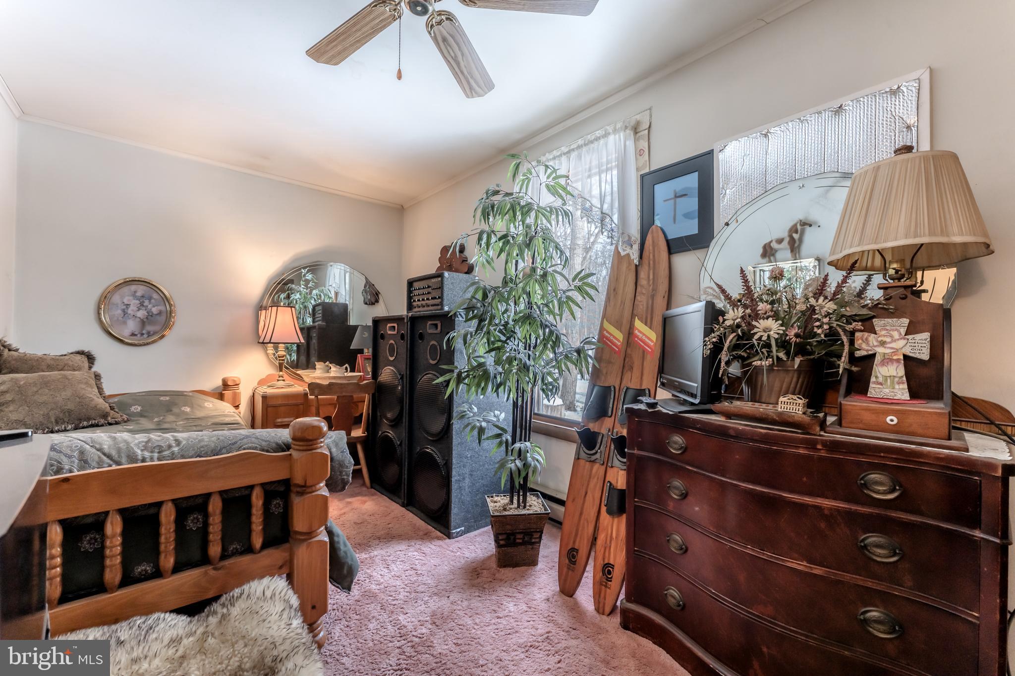 415 White Oak Road Lehighton, PA 18235 - Photo 23 of 45 a bedroom with bed and a chandelier