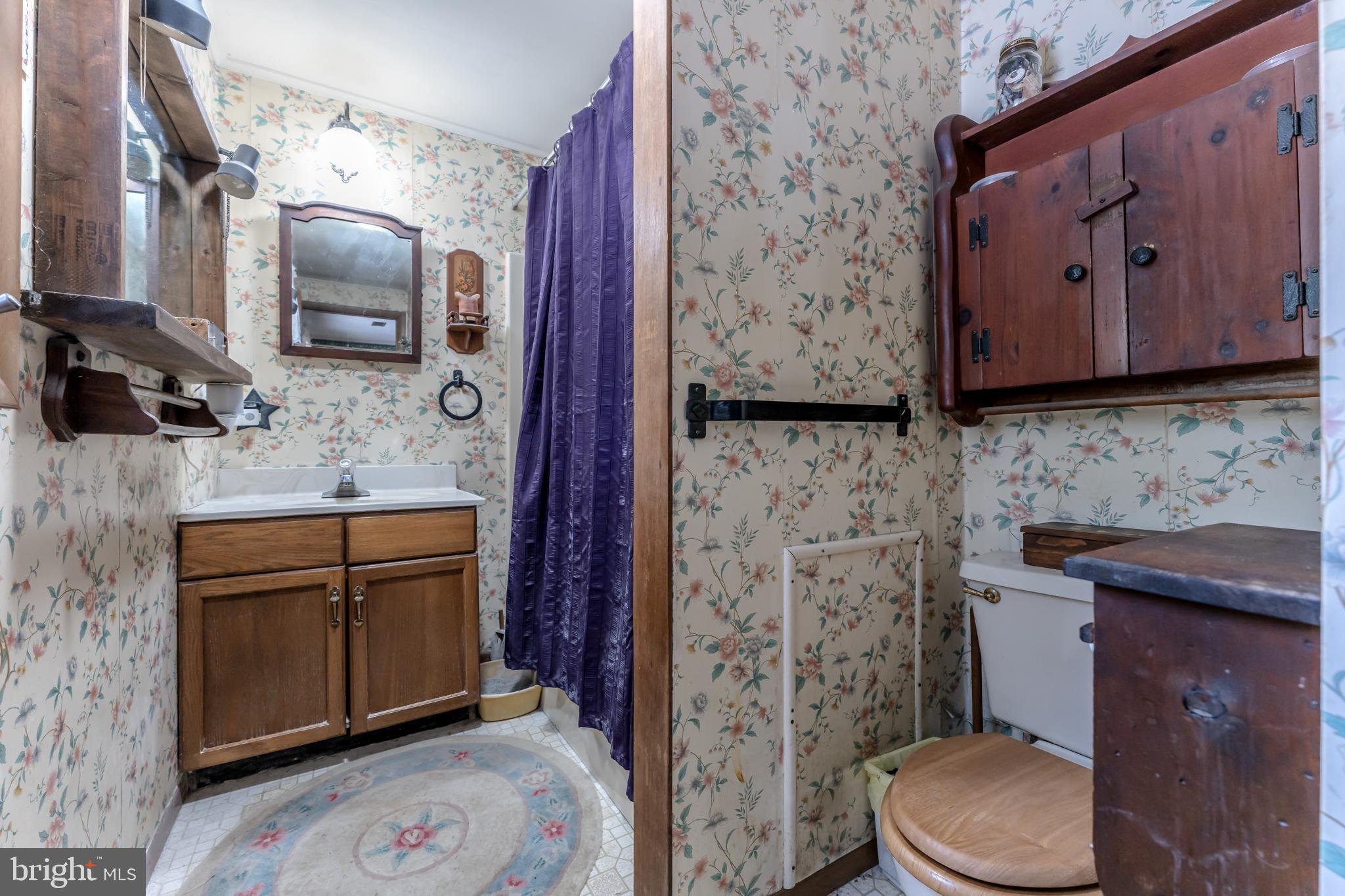 415 White Oak Road Lehighton, PA 18235 - Photo 28 of 45 a bathroom with a granite countertop toilet sink and mirror