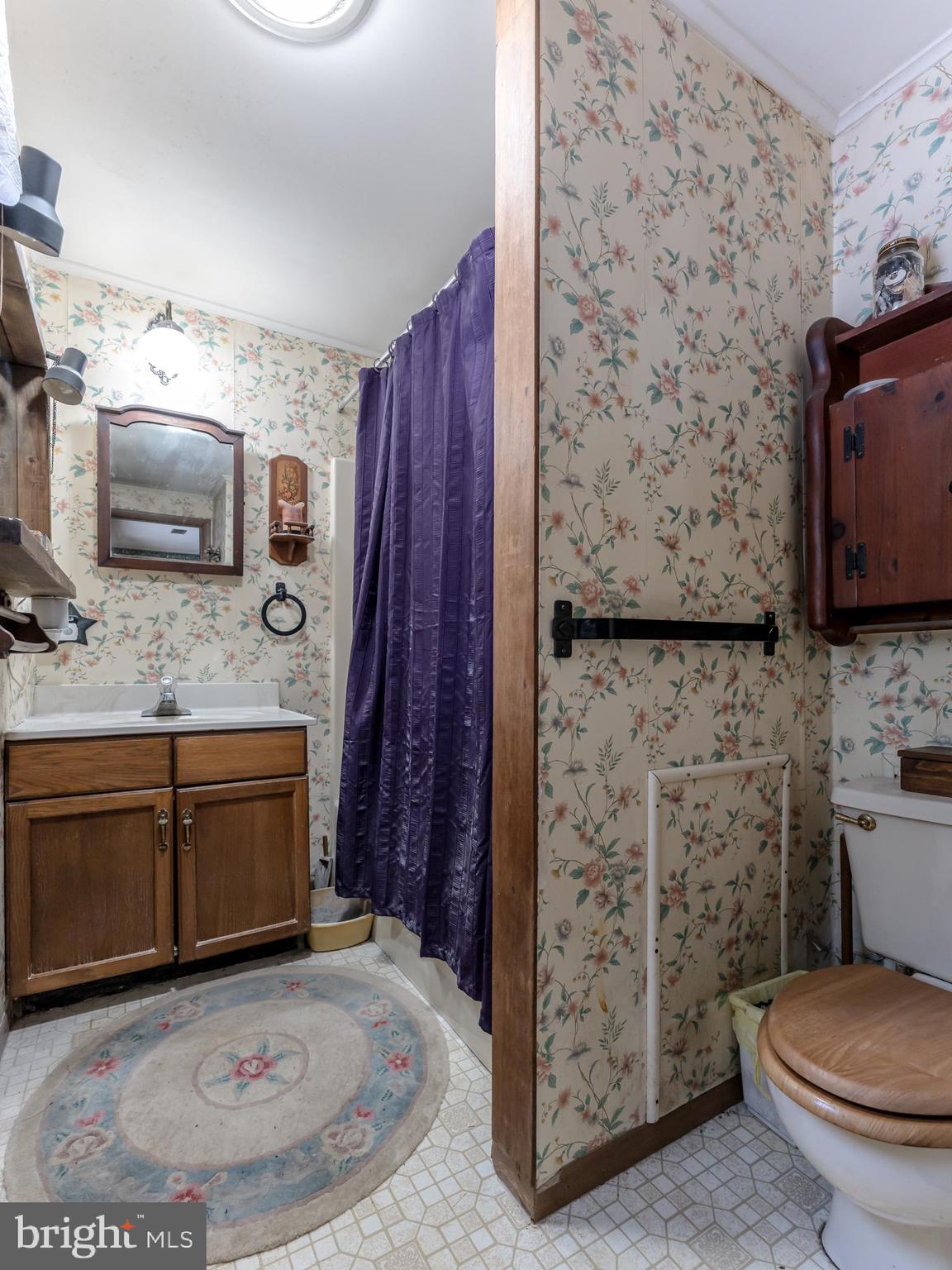 415 White Oak Road Lehighton, PA 18235 - Photo 29 of 45 a bathroom with a granite countertop toilet sink and mirror