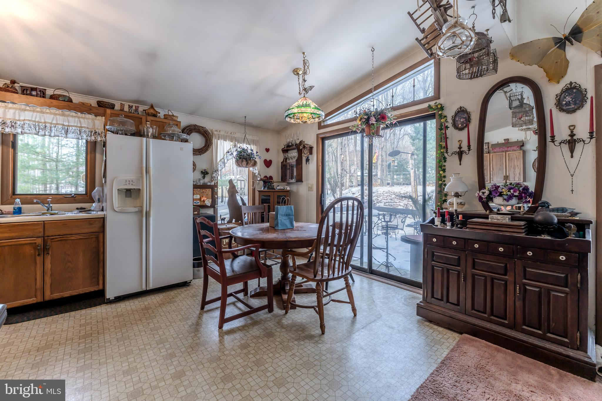415 White Oak Road Lehighton, PA 18235 - Photo 9 of 45 a view of a dining room with furniture window and wooden floor