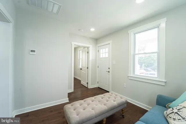 a bedroom with bed and a window