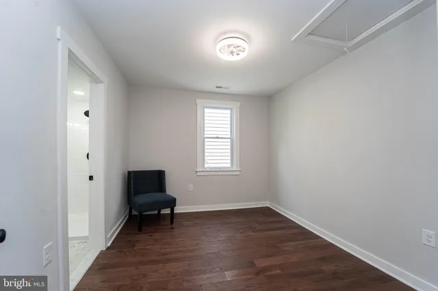 a room that has a window and a chair