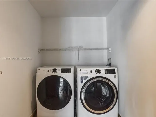 an empty room with wooden floor and window