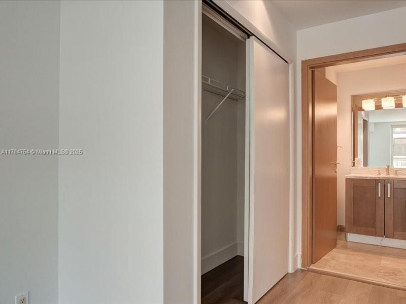 9499 Collins Avenue, Unit PH03 Surfside, FL 33154 - Photo 22 of 82 a view of a hallway with wooden floor
