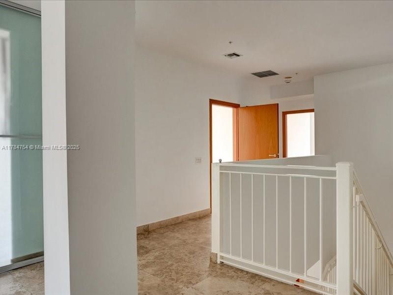 9499 Collins Avenue, Unit PH03 Surfside, FL 33154 - Photo 25 of 82 a view of an entryway with a window