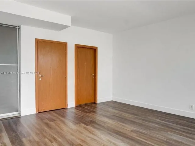 a bathroom with a granite countertop sink and mirror