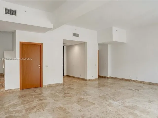 a kitchen with stainless steel appliances granite countertop a sink stove and microwave
