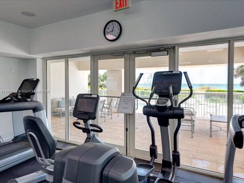 9499 Collins Avenue, Unit PH03 Surfside, FL 33154 - Photo 60 of 82 a view of a workspace with furniture and a window