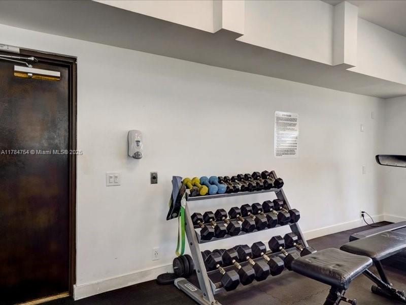 9499 Collins Avenue, Unit PH03 Surfside, FL 33154 - Photo 61 of 82 a bedroom with a bed and a window