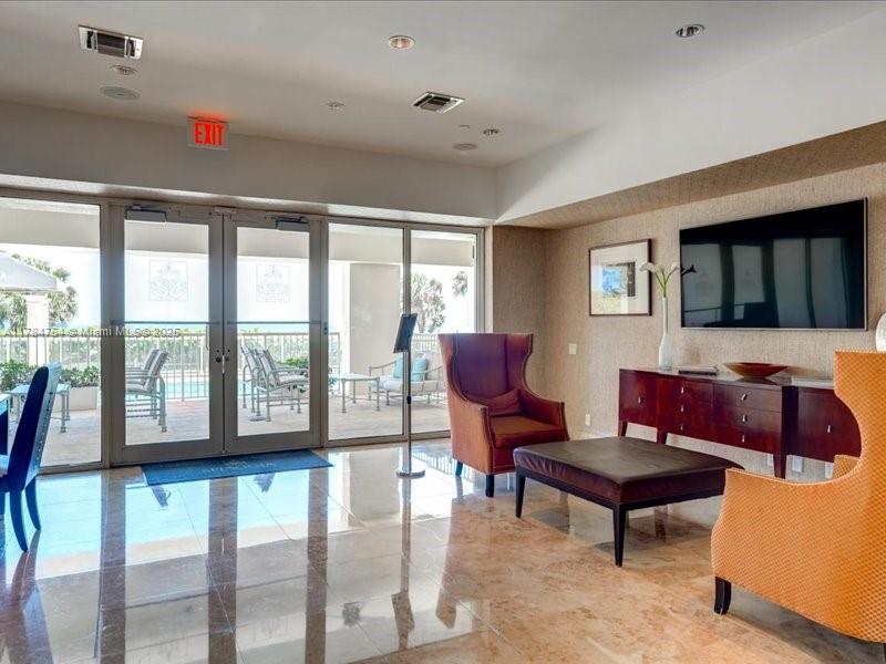 9499 Collins Avenue, Unit PH03 Surfside, FL 33154 - Photo 62 of 82 a living room with furniture and a window