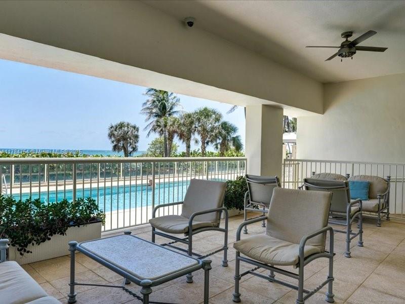 9499 Collins Avenue, Unit PH03 Surfside, FL 33154 - Photo 63 of 82 a balcony view with a potted plant and outdoor seating