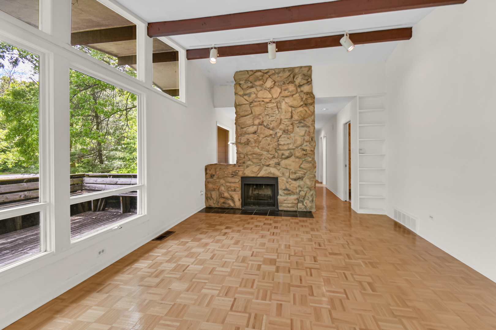 4112 Sunset Road Matteson, IL 60443 - Photo 7 of 28 a view of an empty room with a fireplace and a window