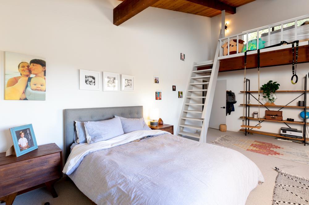 390 Brooktree Ranch Road Aptos, CA 95003 - Photo 21 of 31 a bedroom with a bed and a couch