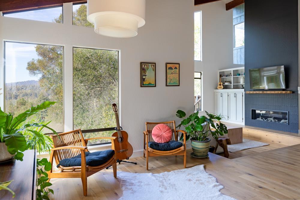 390 Brooktree Ranch Road Aptos, CA 95003 - Photo 6 of 31 a living room with furniture and a potted plant