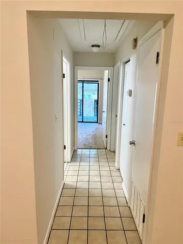 a view of a hallway view with wooden floor and staircase