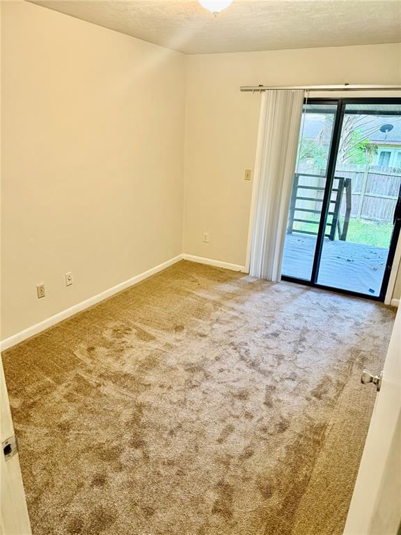 6745 Southwest 45th Avenue Gainesville, FL 32608 - Photo 9 of 12 a view of an empty room with a window