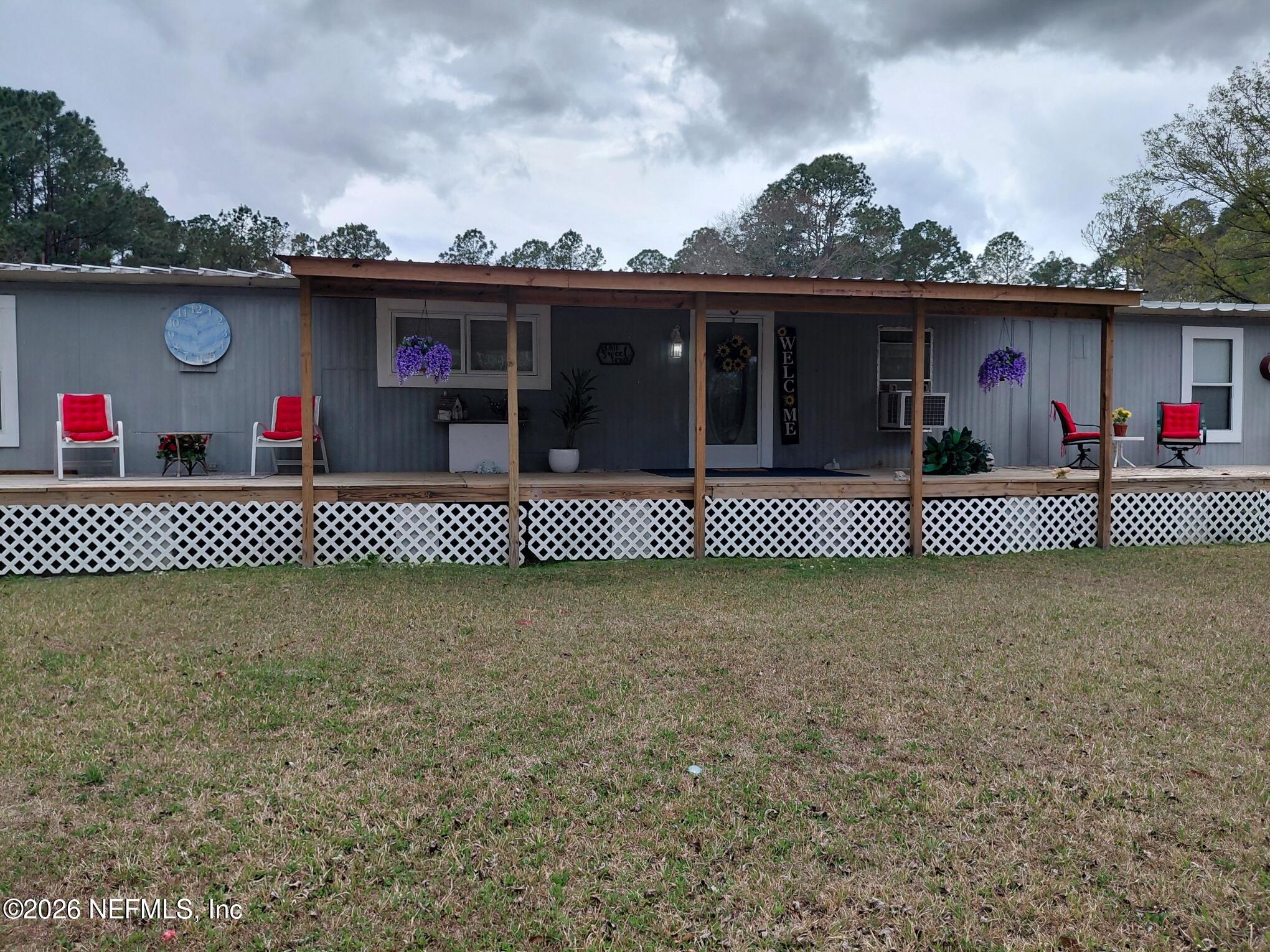 a front view of a house with a large window