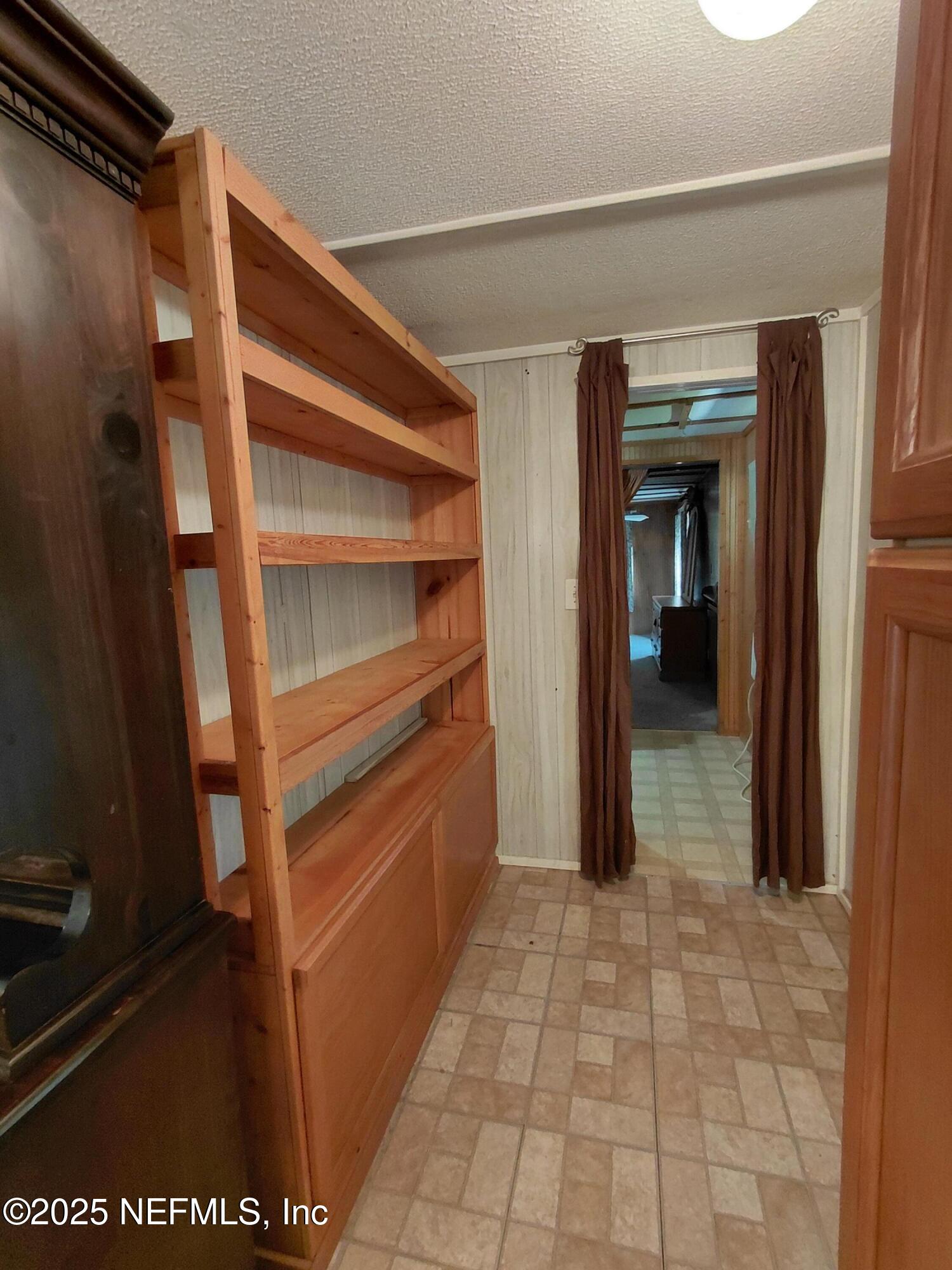 15690 Sears Road Jacksonville, FL 32218 - Photo 11 of 39 a view of walk in closet