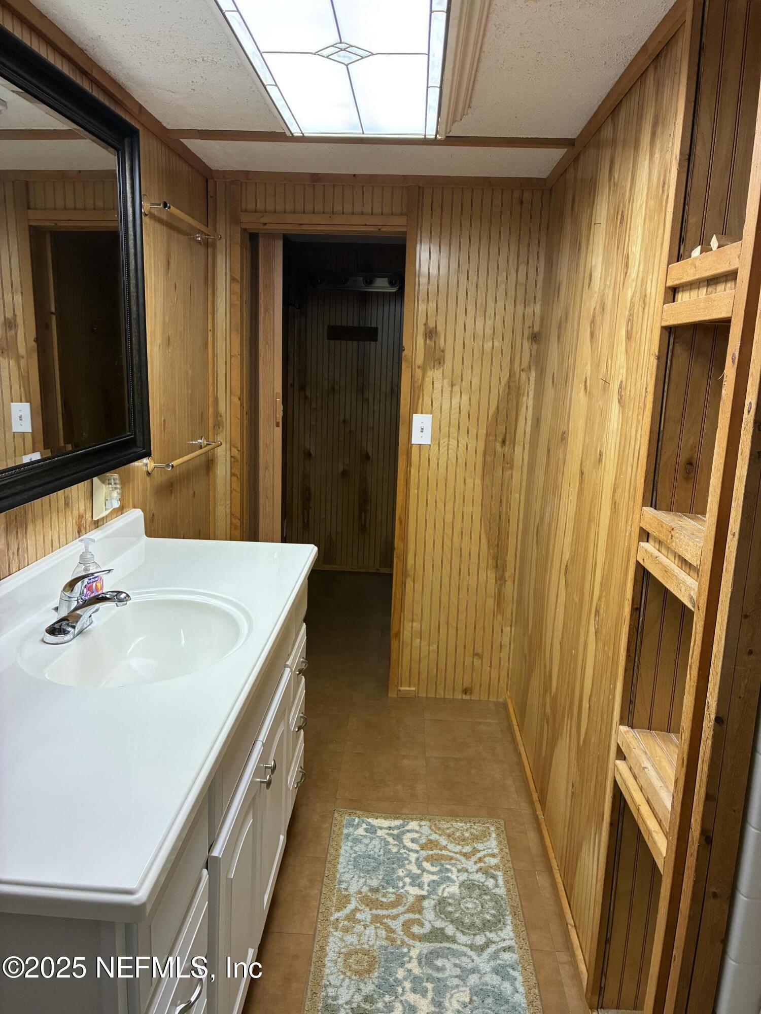 15690 Sears Road Jacksonville, FL 32218 - Photo 18 of 39 a bathroom with a sink and a mirror