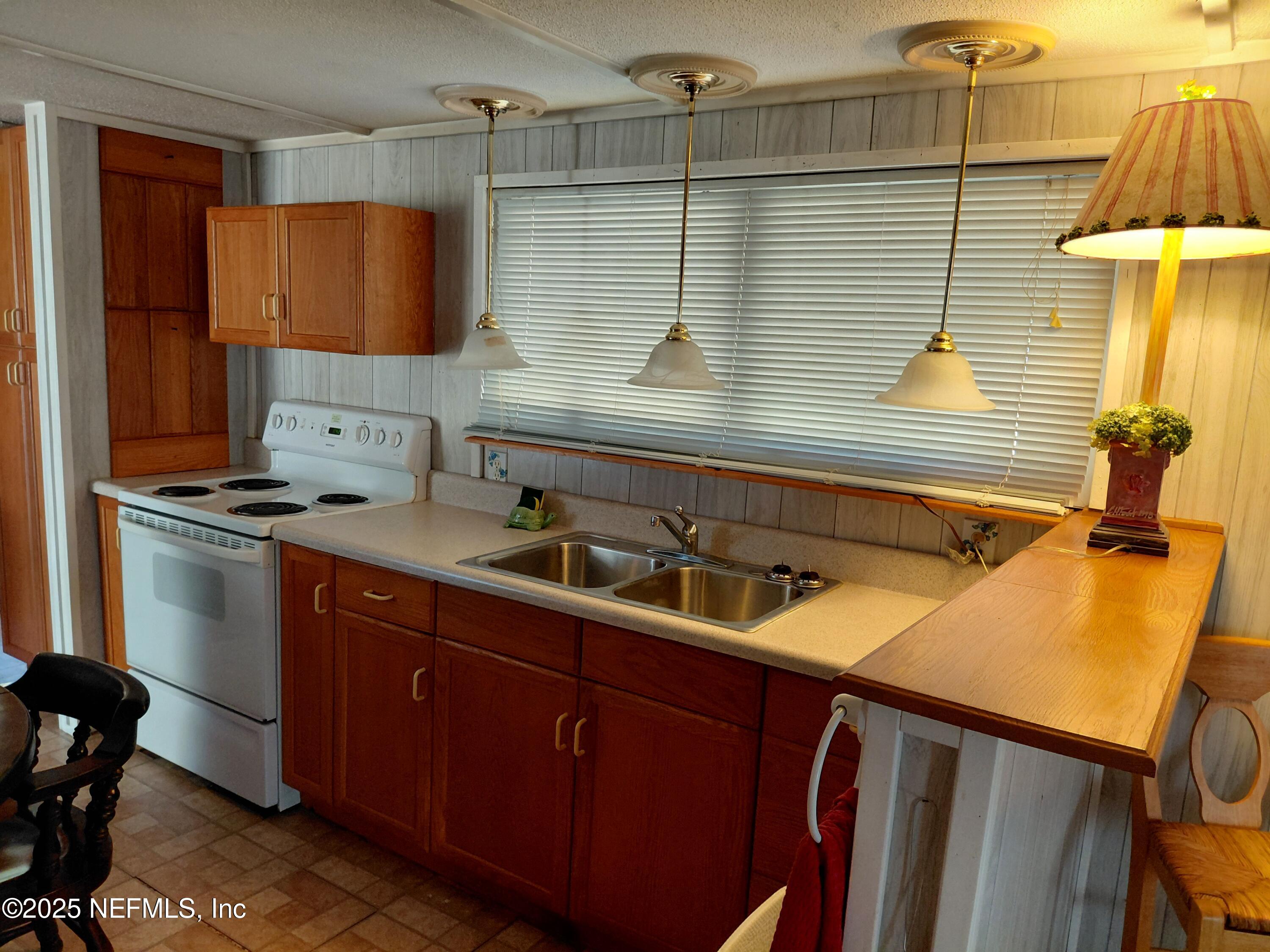 15690 Sears Road Jacksonville, FL 32218 - Photo 10 of 39 a bathroom with a sink and a mirror
